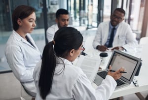 doctors-laptop-meeting-healthcare-office-with-teamwork-documents-research-nurses-collaboration-group-diversity-boardroom-brainstorming-strategy-telemedicine-development