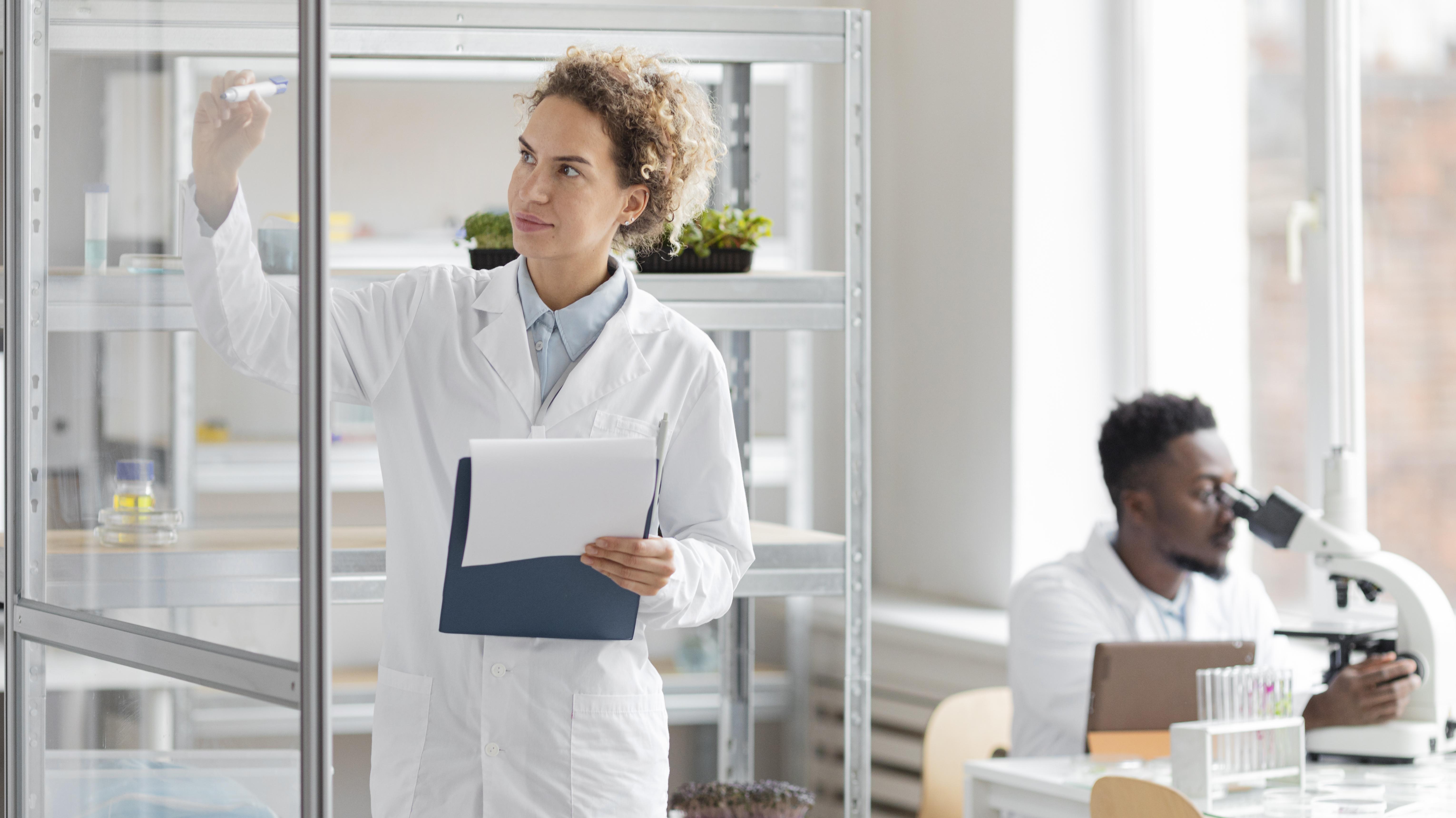 Researcher reviewing study materials in a laboratory
